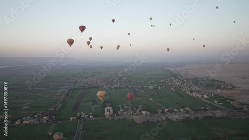 View of hot air balloons over Luxor and Nile river at sunrise, Luxor, Egypt, North Africa, Africa