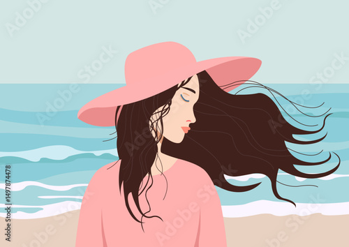 Ragazza con i capelli al vento sulla spiaggia
