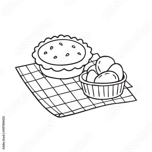 A tart next to a box of potato chips on a picnic mat