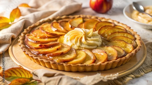 Wallpaper Mural A golden brown apple tart with a swirl of creamy filling, nestled on a wooden board and adorned with autumnal leaves. Torontodigital.ca