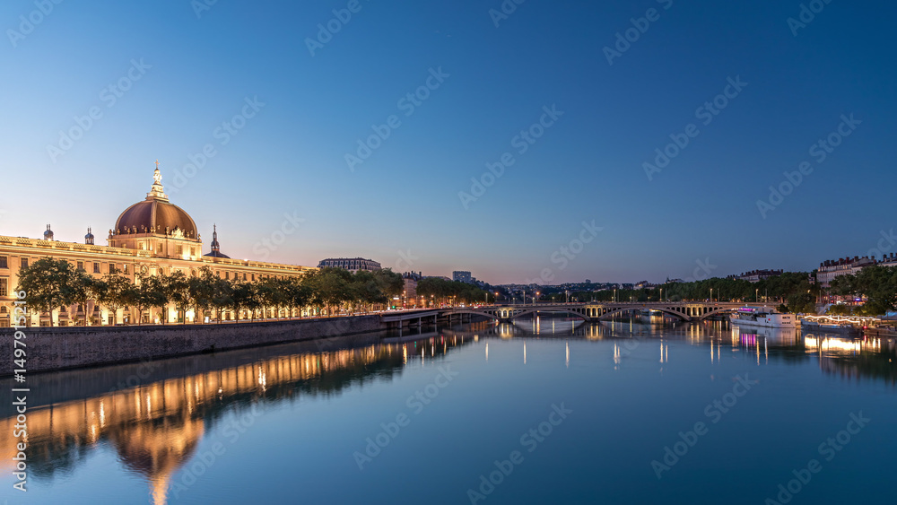 Fototapeta premium The Grand Hotel-Dieu Day to night transition timelapse hyperlapse in Lyon, France.