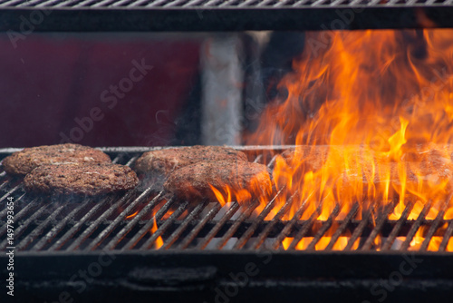 Flames meet flavor – burgers grilled to perfection.