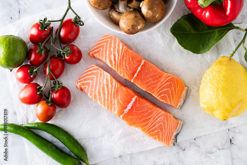 fresh, healthy ingredients and salmon on the table. fish for dinner with mushrooms