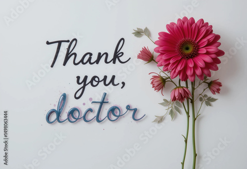 A flower arrangement with a pink flower and the words "Thank You