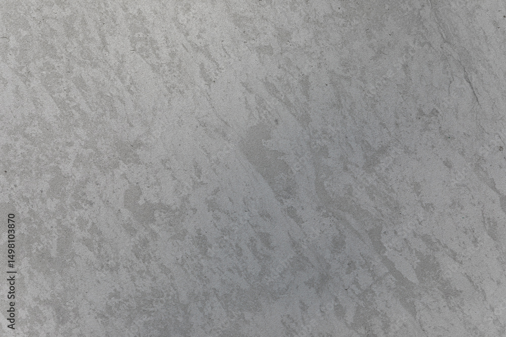 Obraz premium Rough gray concrete surface with natural stains and texture, ideal for backgrounds, construction themes, or architectural mockups.
