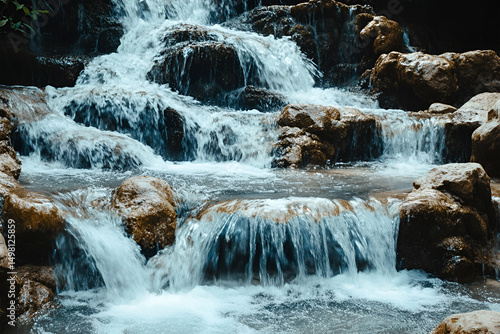 Serene Waterfall Cascading Over Rocks Nature's Beauty