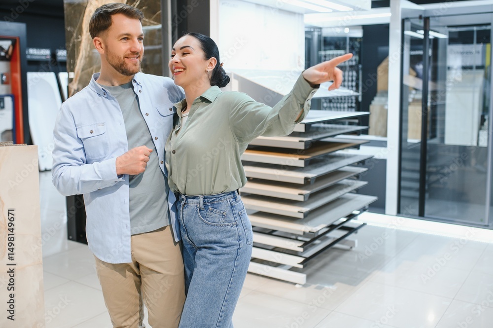 Fototapeta premium Couple choosing tiles in hardware store for home renovation project