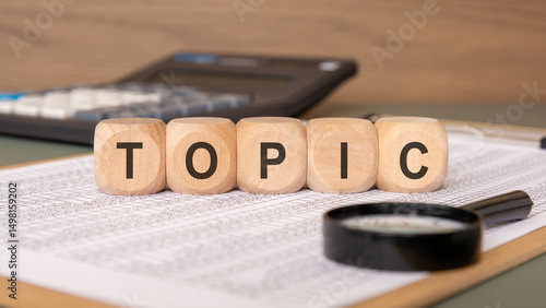 Wallpaper Mural Wooden cubes with word TOPIC on a spreadsheet. Torontodigital.ca