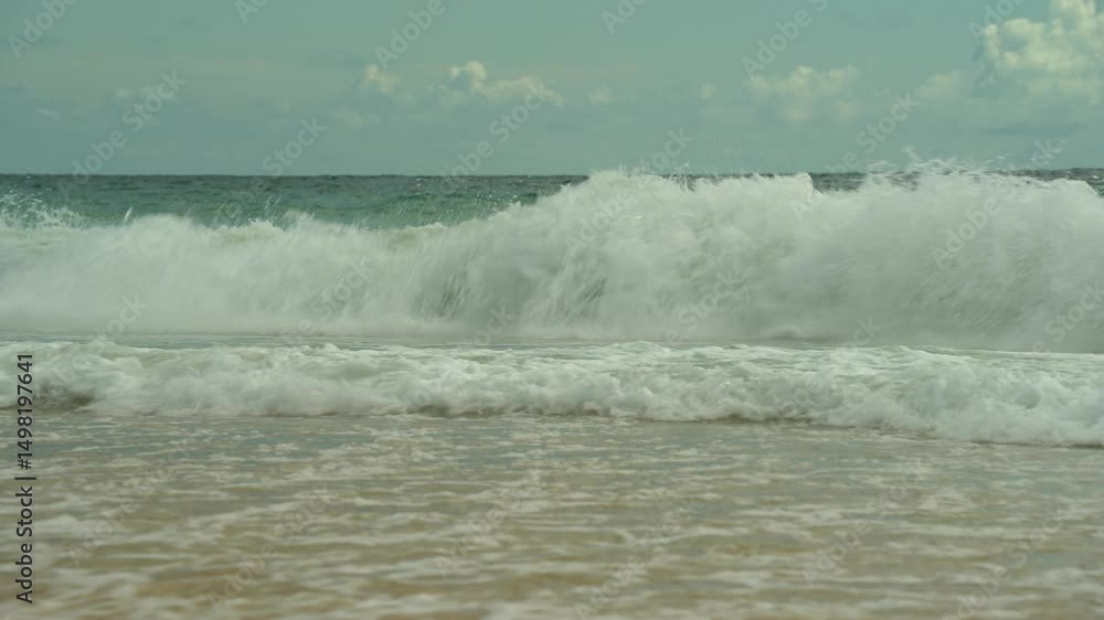 The sea tide washes the sandy beach shore and goes back The sea tide washes the sandy beach shore and goes back