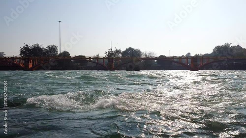 River Haridwar Kumbh mela. Ganga water is used by hindu pilgrimage in Dehradun Uttarakhand. Water is blue and flows very fast.