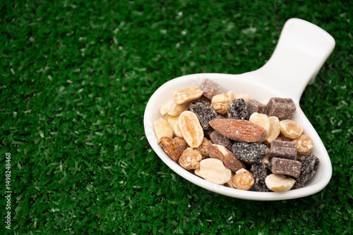 Nuts. Almonds, grapes, chocolate, roasted peanuts. 