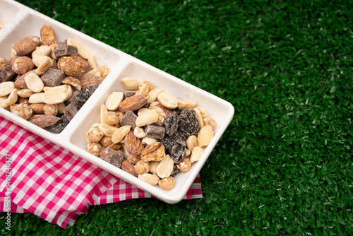 Nuts. Almonds, grapes, roasted peanuts. 