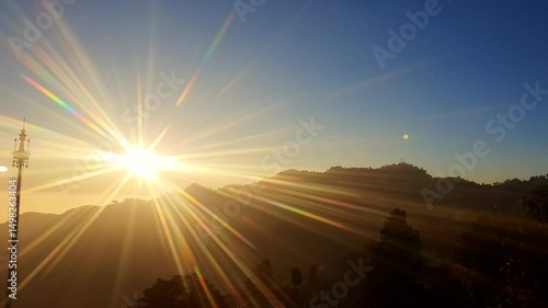 Mussoorie forest Uttarakhand winter lineis visible on the western horizon in the evening from midOctober to January. Sun sets, shades of yellow, red, orange, purple.
