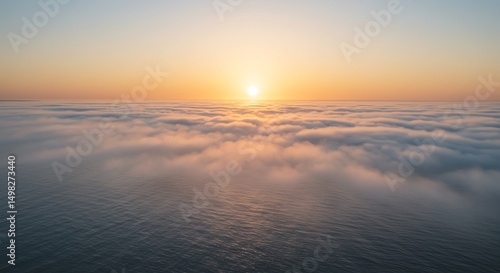 Aerial Sunrise Over Clouds and Ocean