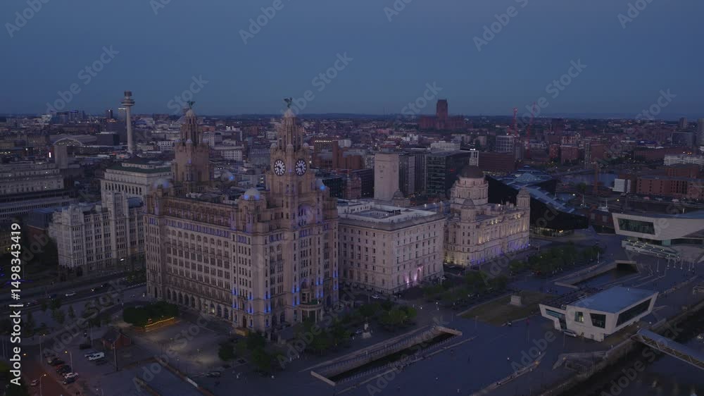 Establishing aerial view of Liverpool skyline at night. Iconic illuminated cityscape in Merseyside, England, United Kingdom Establishing aerial view of Liverpool skyline at night. Iconic illuminated cityscape in Merseyside, England, United Kingdom