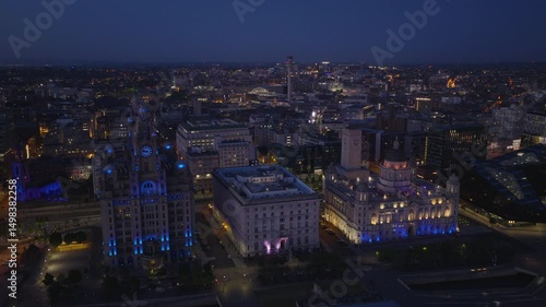 Wallpaper Mural Establishing aerial view of Liverpool skyline at night. Iconic illuminated cityscape in Merseyside, England, United Kingdom	 Torontodigital.ca