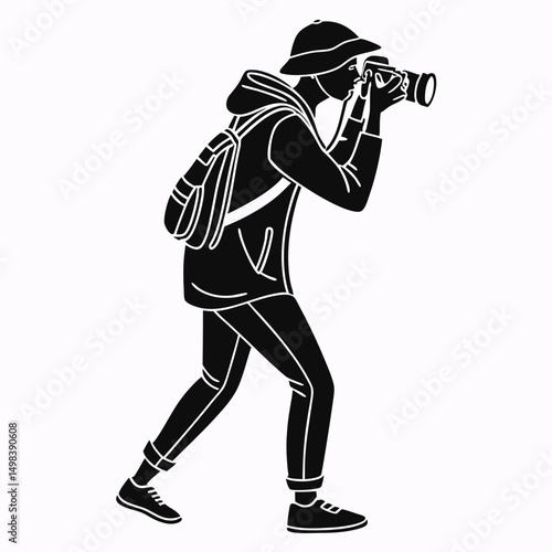 Photographer with backpack taking pictures outdoors