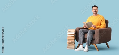 Handsome man reading books ...