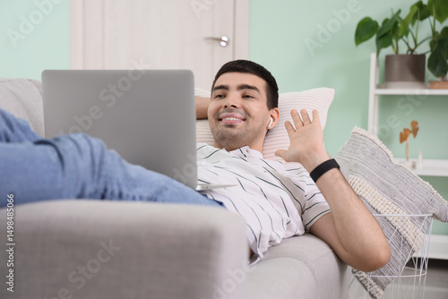Young man with laptop video...