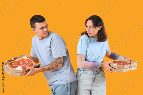 Young couple with tasty pep...