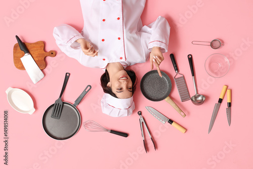 Happy young female cook wit...