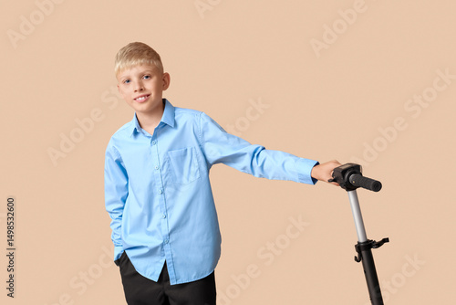 Cute schoolboy with modern ...