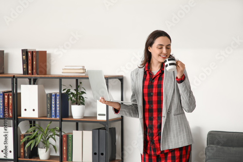 Young businesswoman with co...