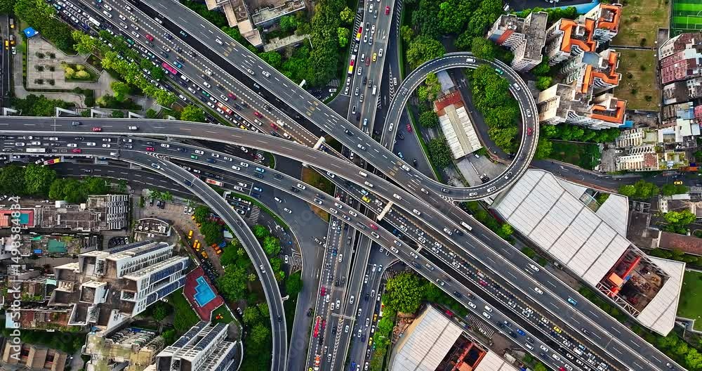 Aerial view of a complex highway interchange and busy city traffic in Guangzhou, China. City traffic background.