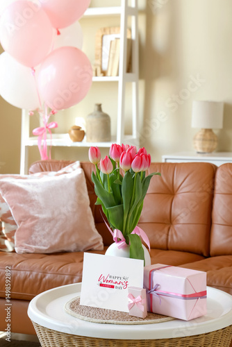 Vase with tulips, gifts and...
