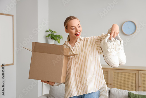 Young woman with parcel box...