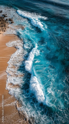 Aerial View of Turquoise Ocean Waves Crashing on Sandy Beach
