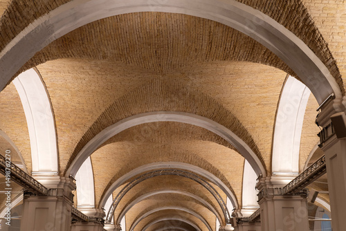 Slika na platnu Historic brick groin vault ceiling with white arches, architectural detail