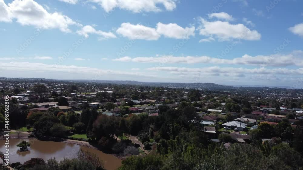 4K Video of drone ascending from a green garden with a lake showing a residential suburb in Toowoomba, Australia 4K Video of drone ascending from a green garden with a lake showing a residential suburb in Toowoomba, Australia