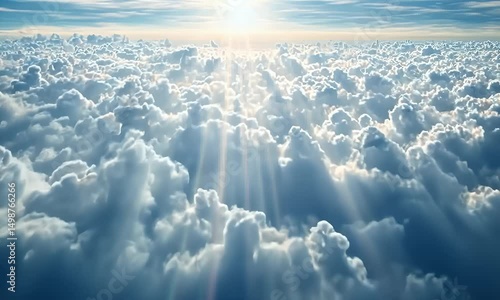 Sunbeams pierce through a boundless expanse of fluffy cumulus clouds, creating a breathtaking, ethereal vista