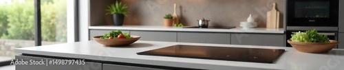 A sleek, modern kitchen countertop with a built-in induction stovetop  Clean lines, minimalist design, perfect for culinary inspiration ,  home improvement,  gray,  lifestyle
