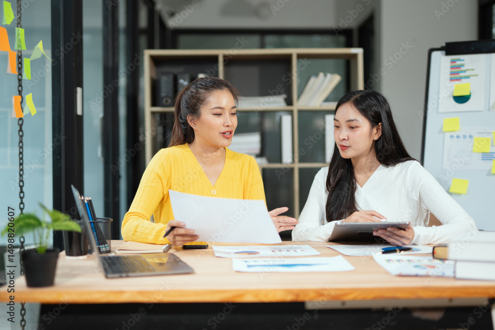 Two businesswoman hands or accountants working together on financial investment on calculator, calculating, analyzing business growth and marketing on graph. Two businesswoman hands or accountants working together on financial investment on calculator, calculating, analyzing business growth and marketing on graph.