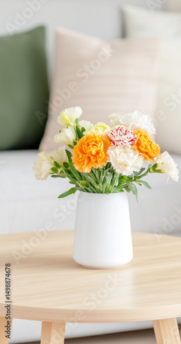 Wallpaper Mural A bright bouquet of carnation flowers in a stylish vase on the wooden table, the backdrop a soft focus of the sofa and pillow. Torontodigital.ca