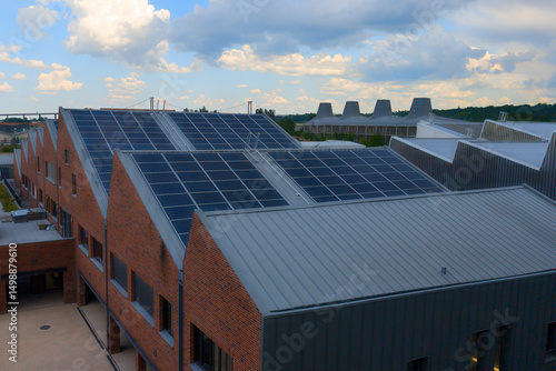 aerial view of solar panel on the roof of the old factory warehouse converted into residential housing in the city