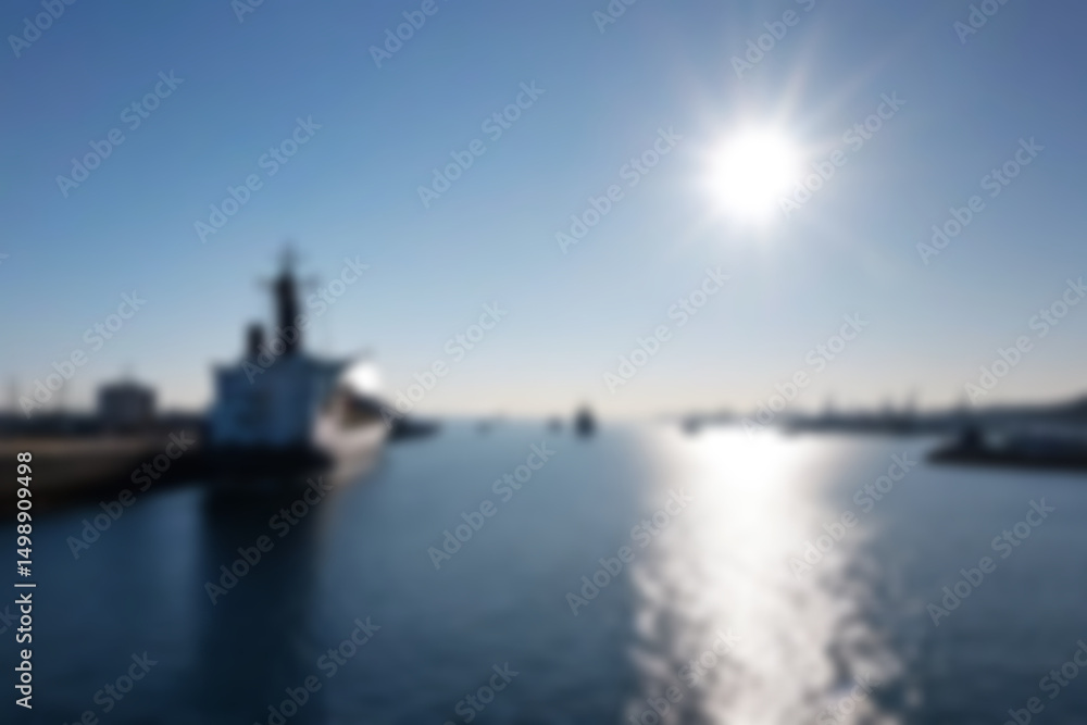 Fototapeta premium blurry harbor, bright ship harbor, exposed to morning sunlight, large ships are seen docked at the harbor pier, wallpaper, blurry background.