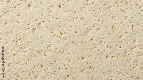 Obraz na płótnie Closeup texture of light beige porous material with irregular holes