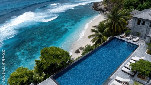 Luxurious infinity pool overlooking tropical beach and ocean waves