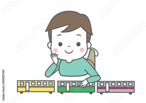 電車のおもちゃを整列させて遊んでいる男の子