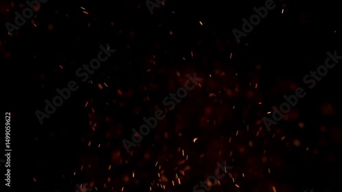 Blurred bokeh motion picture of animation Flying around red yellow fire dust particles sparks or embers from a burning fire with realistic movement on a black background 
