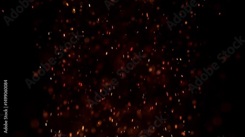 Blurred bokeh motion picture of animation Flying around  straight up red yellow fire dust particles sparks or embers from a burning fire with realistic movement on a black background 
