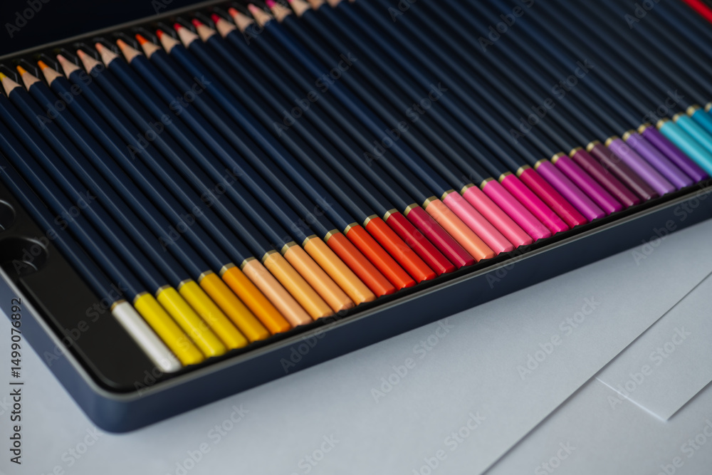 Fototapeta premium Set of color pencils in pencil case. Big beautiful color palette watercolor pencils for creativity drawing, close-up, high resolution.