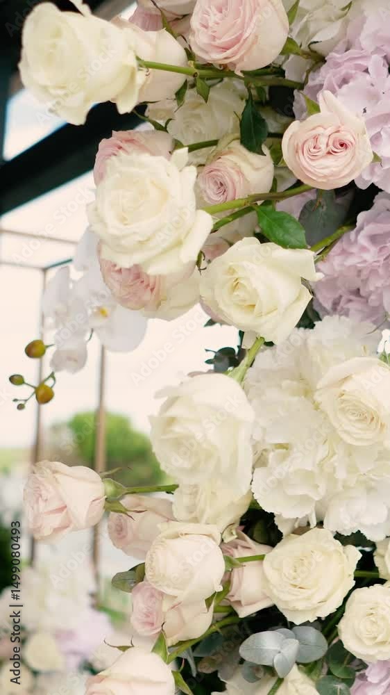 wedding arch of white rose flowers on the river bank before the wedding ceremony of the bride and groom, festive romantic decor wedding arch of white rose flowers on the river bank before the wedding ceremony of the bride and groom, festive romantic decor