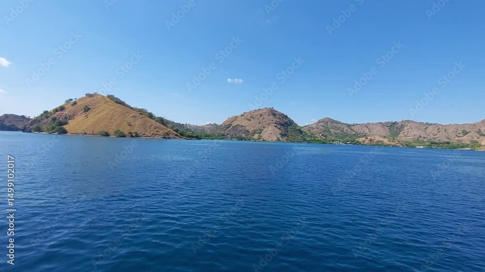 beautiful view of the vast blue ocean with brown and dry hills in the waters of Labuan Bajo
beautiful view of the vast blue ocean with brown and dry hills in the waters of Labuan Bajo