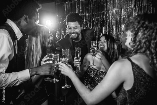 Photography Friends toasting champagne flutes at glamorous party