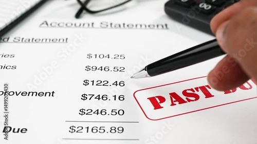 Reviewing credit card statement with outstanding payment.