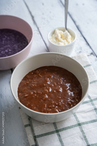 chocolate champorado topped with milk powder; a sweetened flavored porridge that are famous among Filipinos
